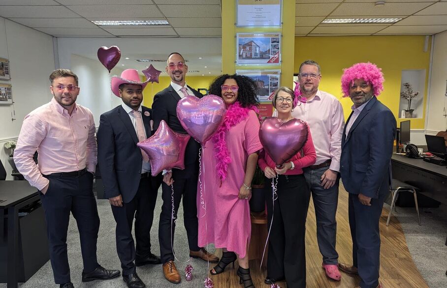 A group of JNP staff dressed in pink