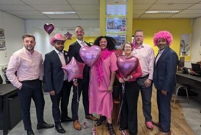 A group of JNP staff dressed in pink