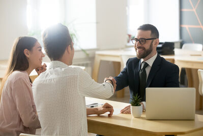 Three people having a meeting