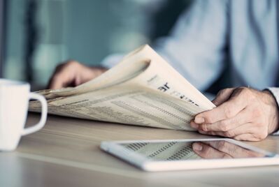Someone reading a newspaper