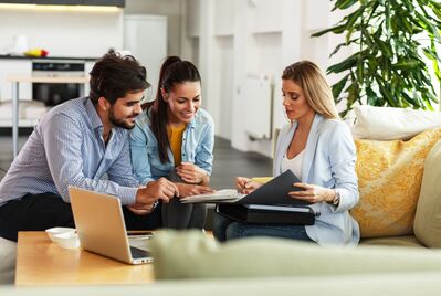 Three people having a meeting