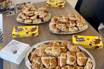 Plate of hot cross buns of a table