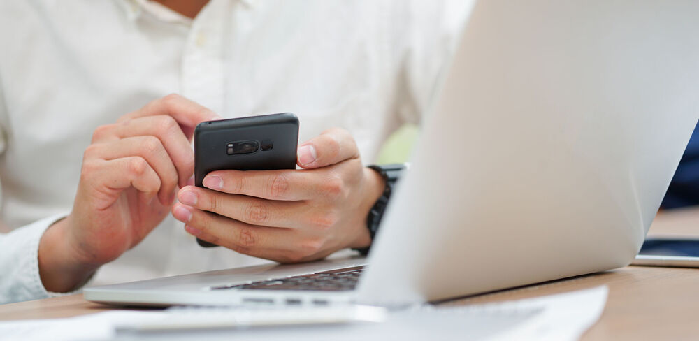 Man checking alert notification on smart phone