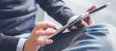 Man looking at tablet