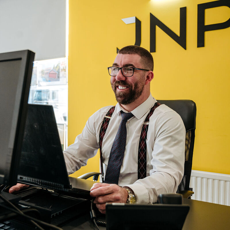 jnp agent working at a desk
