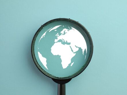 Globe in a magnifying glass